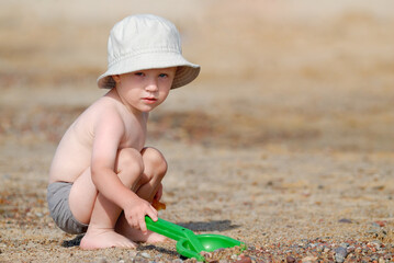 Little boy playing on the beach