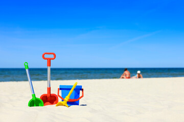 Baby toys on a sandy beach