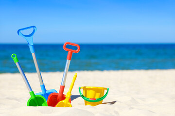 Baby toys on a sandy beach