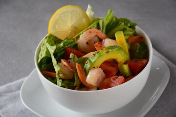 Avocado salad with shrimps and cherry tomatoes. Seafood breakfast