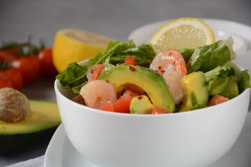 Avocado salad with shrimps and cherry tomatoes. Seafood breakfast
