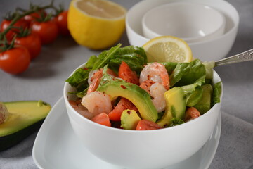 Avocado salad with shrimps and cherry tomatoes. Seafood breakfast