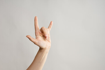 Hand gestures, Thumbs up, that's a cool gesture of the rocker. women's hand