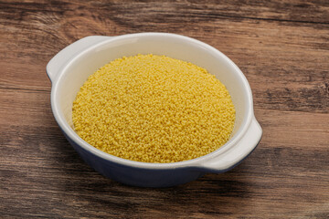Raw cous cous heap in the bowl