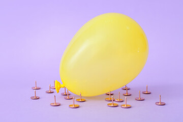 Office pins and air balloon on color background