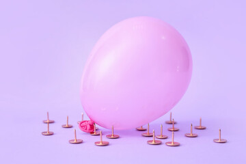 Office pins and air balloon on color background © Pixel-Shot