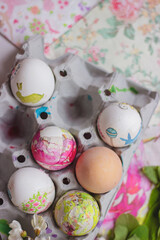 Colorful Easter eggs, in cardboard box, decorated with decoupage technique. 