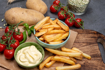 Bown with fresh cooked french fries potato chips with belgian mayonnaise sauce