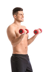 Sporty young man training with dumbbells on white background