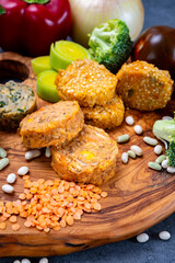 Small tasty vegan and vegetarian burgers made from fresh vegetables and dried legumes and beans