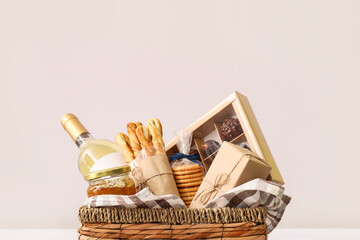 Gift basket with products on light background - Powered by Adobe