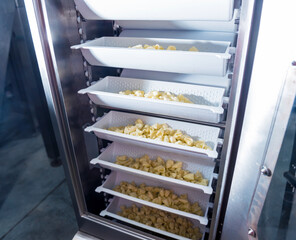 Conveyor line for packing snacks and chips in a modern factory