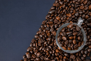 Freshly roasted coffee beans background. Coffee beans background. Coffee background. Texture of freshly roasted coffee.
