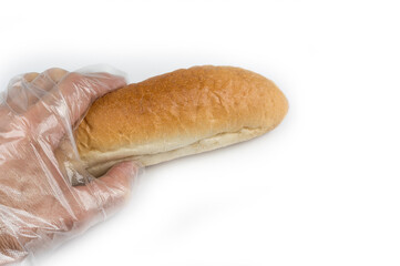 Man holding bread in a hygienic glove