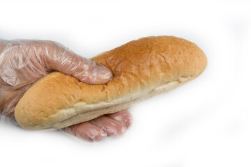 Man holding bread in a hygienic glove