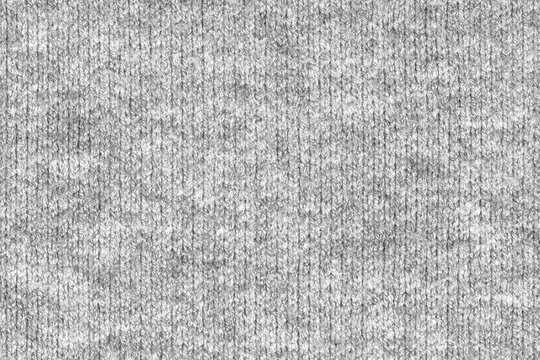 Gray natural texture of knitted wool textile material background. grey crochet cotton fabric woven canvas texture. close up
