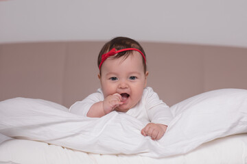 newborn lying on the bed