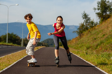Happy young people rollerblading, skateboarding
