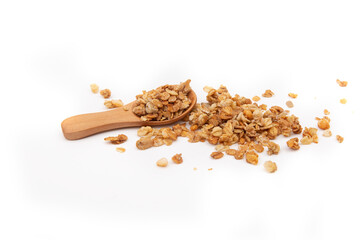Granola with wooden spoon isolated on white background. Top view, healthy meal.