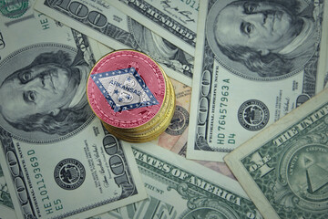 golden shining bitcoins with flag of arkansas state on a dollar money background.