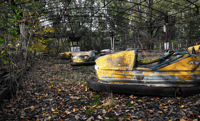 35 years old rusty park amusement cars from abandoned city after nuclear catastrophe 