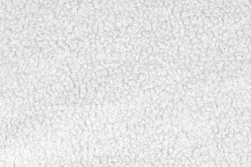 White natural texture of knitted wool textile material background. White crochet cotton fabric woven canvas texture. close up