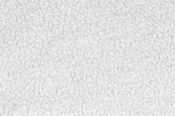 White natural texture of knitted wool textile material background. White crochet cotton fabric woven canvas texture. close up