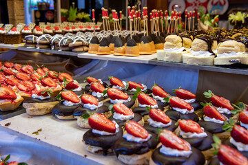 Open buffet full of delicious fruits with orange, grape, watermelon
