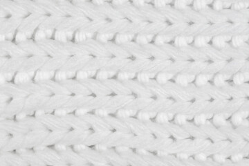 White natural texture of knitted wool textile material background. White crochet cotton fabric woven canvas texture. close up