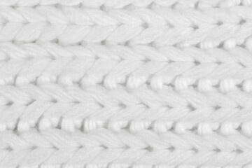 White natural texture of knitted wool textile material background. White crochet cotton fabric woven canvas texture. close up
