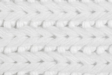 White natural texture of knitted wool textile material background. White crochet cotton fabric woven canvas texture. close up