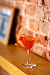 Orange coctail shot in the bar