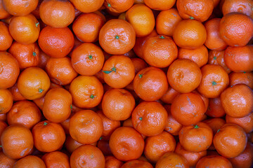 Fresh orange, tangerine fruit, mandarin background, top view, close up