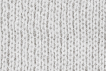 Naklejka premium White natural texture of knitted wool textile material background. White crochet cotton fabric woven canvas texture. close up