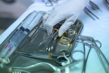 Surgical equipment and medical devices in operating room. Sterile scissors and other medical...