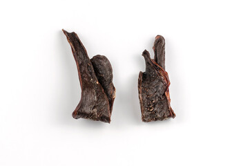 Pet treats on a white background. Dried beef heart.
