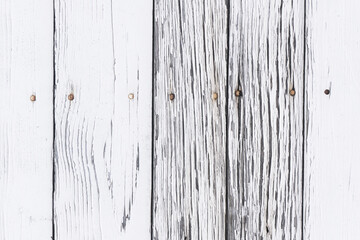 Peeling paint texture. White wood background. Paint desk texture. Cracked wooden wall pattern. Gray...