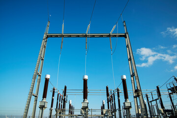 Low angle view of transformers at power station