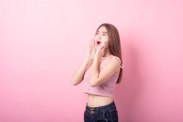Portrait of beautiful asia young woman on Pink color background with copy space. Human face...
