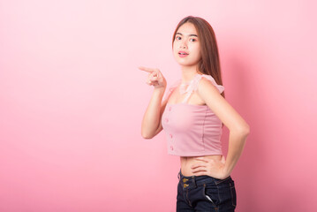 Portrait of beautiful asia young woman on Pink color background with copy space. Human face...