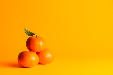 tangerines with orange background