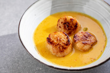 Scallops in spicy gulai sauce, Indonesian curry
