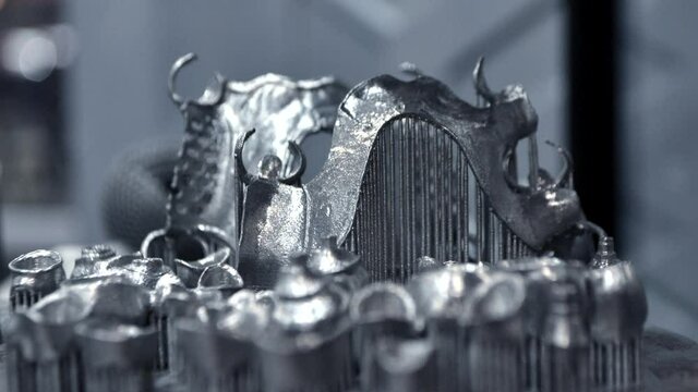 3D model of human teeth printed on metal 3d printer close-up. Technology selective laser melting, sintering metal. New prototyping additive technology. Medical stomatological dental crowns bridge