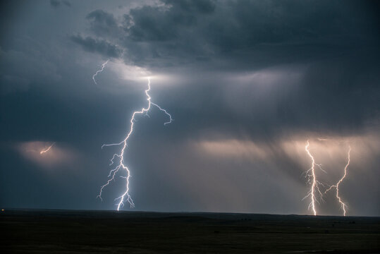 Low angle majestic view of thunderstorm and lightning at Badlands National Park