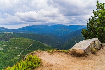 high waterfall with a beautiful landscape of the mountains in the Czech Republic