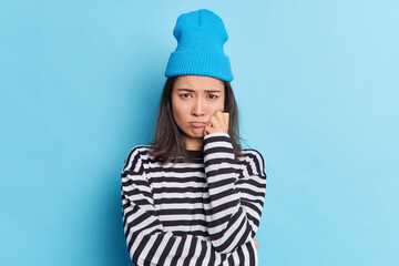 Displeased frustrated brunette Asian woman has offended face expression looks sadly being in bad...