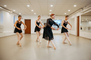 Teacher and young ballerinas, performance in class