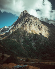 Russia, Caucasus, Dombay, Dombay-Ulgen mountain illuminated by the setting sun
