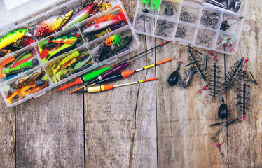 accessories for fishing on a wooden background. selective focus.