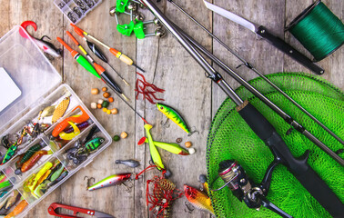 accessories for fishing on a wooden background. selective focus.